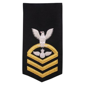 Navy E7 Female Rating Badge: AO Aviation Ordnanceman, seaworthy gold on blue