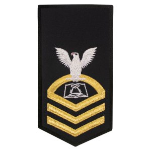 Navy E7 Female Rating Badge: CS Culinary Specialist, seaworthy gold on blue