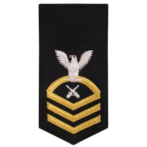 Navy E7 Female Rating Badge: GM Gunners Mate, seaworthy gold on blue