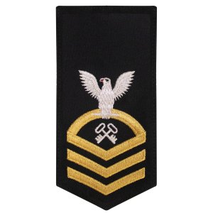 Navy E7 Female Rating Badge: LS Logistics Specialist, seaworthy gold on blue