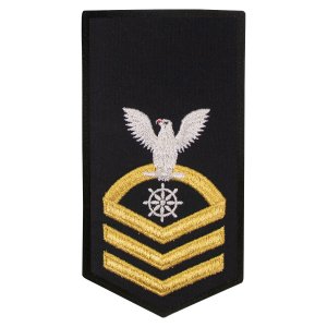Navy E7 Female Rating Badge: QM Quartermaster, seaworthy gold on blue