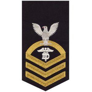 Navy E7 Male Rating Badge: Dental Technician, seaworthy gold on blue