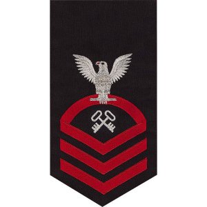 Navy E7 Male Rating Badge: Storekeeper and Logistics Specialist, seaworthy red on blue