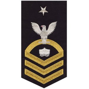 Navy E8 Male Rating Badge: Mineman, seaworthy gold on blue