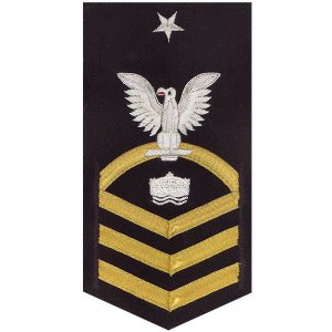 Navy E8 Male Rating Badge: Mineman, vanchief on blue